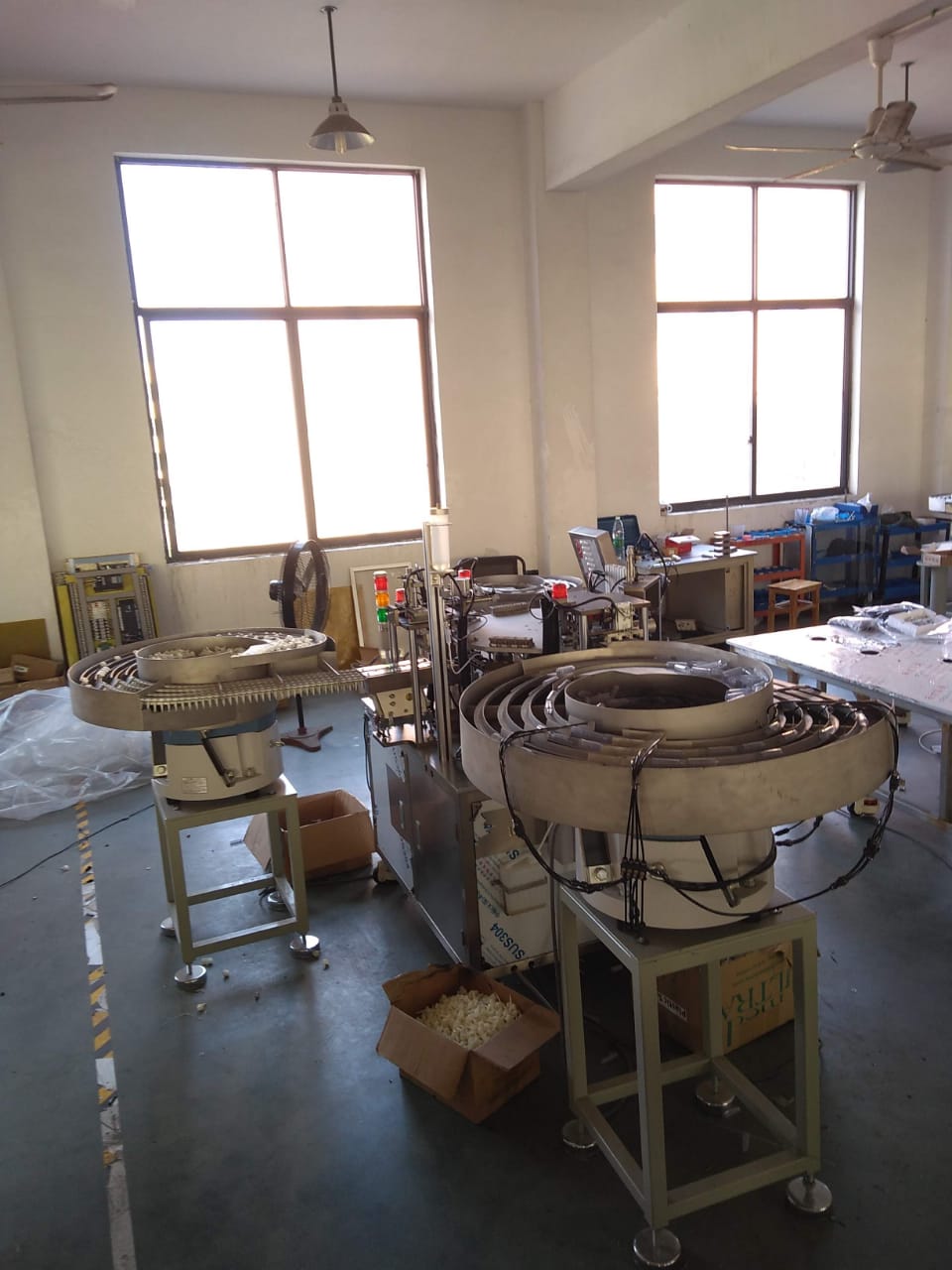 IV set component feeding stations on the factory floor